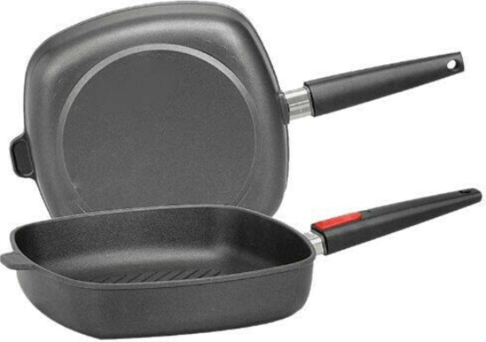 Steakpfanne viereckig mit Rillen und abnehmbarem Griff Viereckige Pfanne mit Griff  in der Mitte mit rotem Punkt markiert freigestellt vor weißem Hintergrund