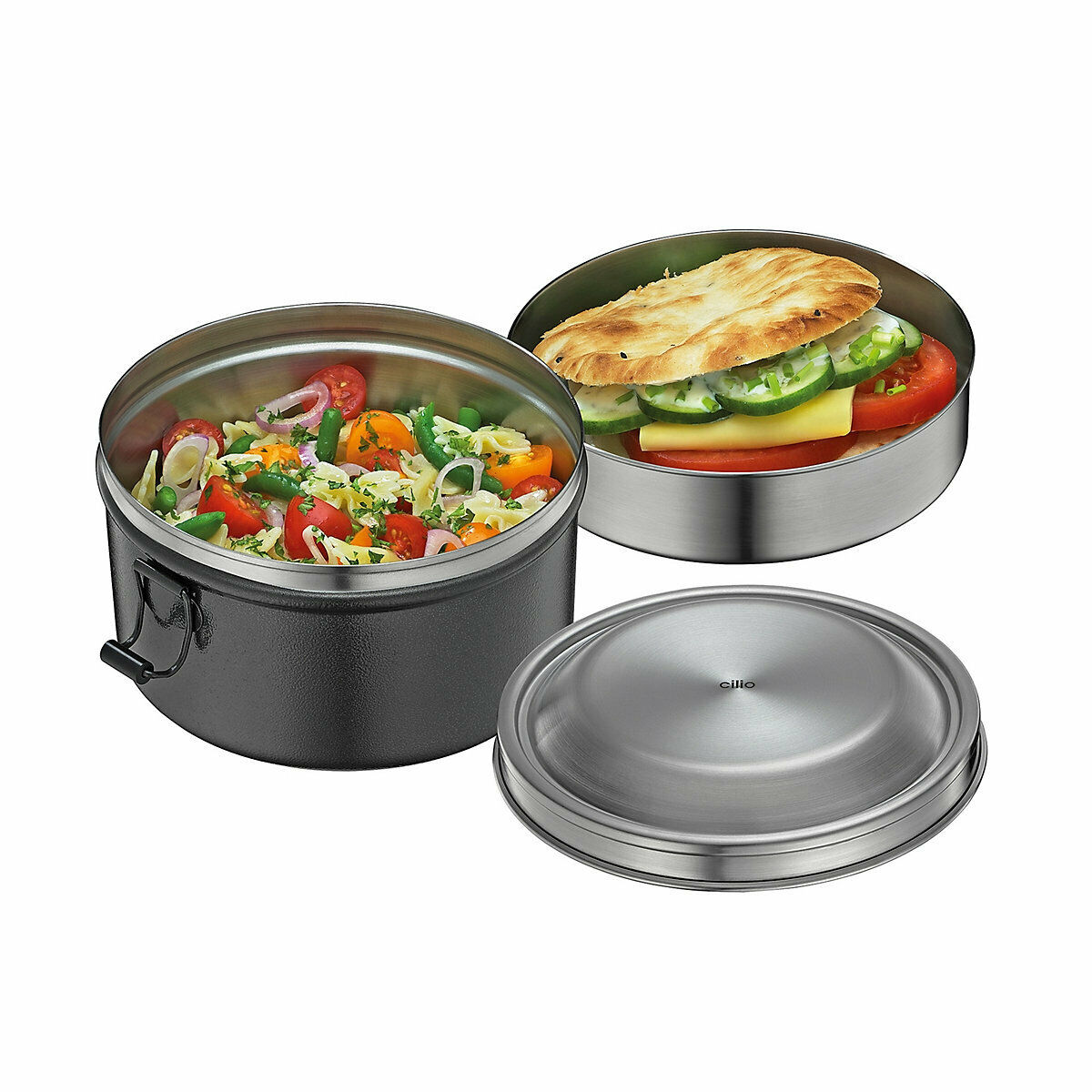 Runde schwarze Lunchbox  gefüllt mit Gemüse und Fleisch  Deckel daneben liegend