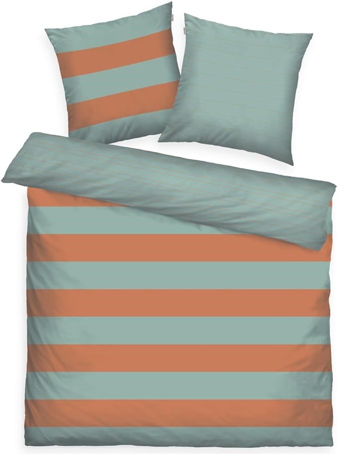 Bett mit zwei Wende-Kissen und Decke in Türkis/Orange gestreift und einfarbig Türkis Draufsicht