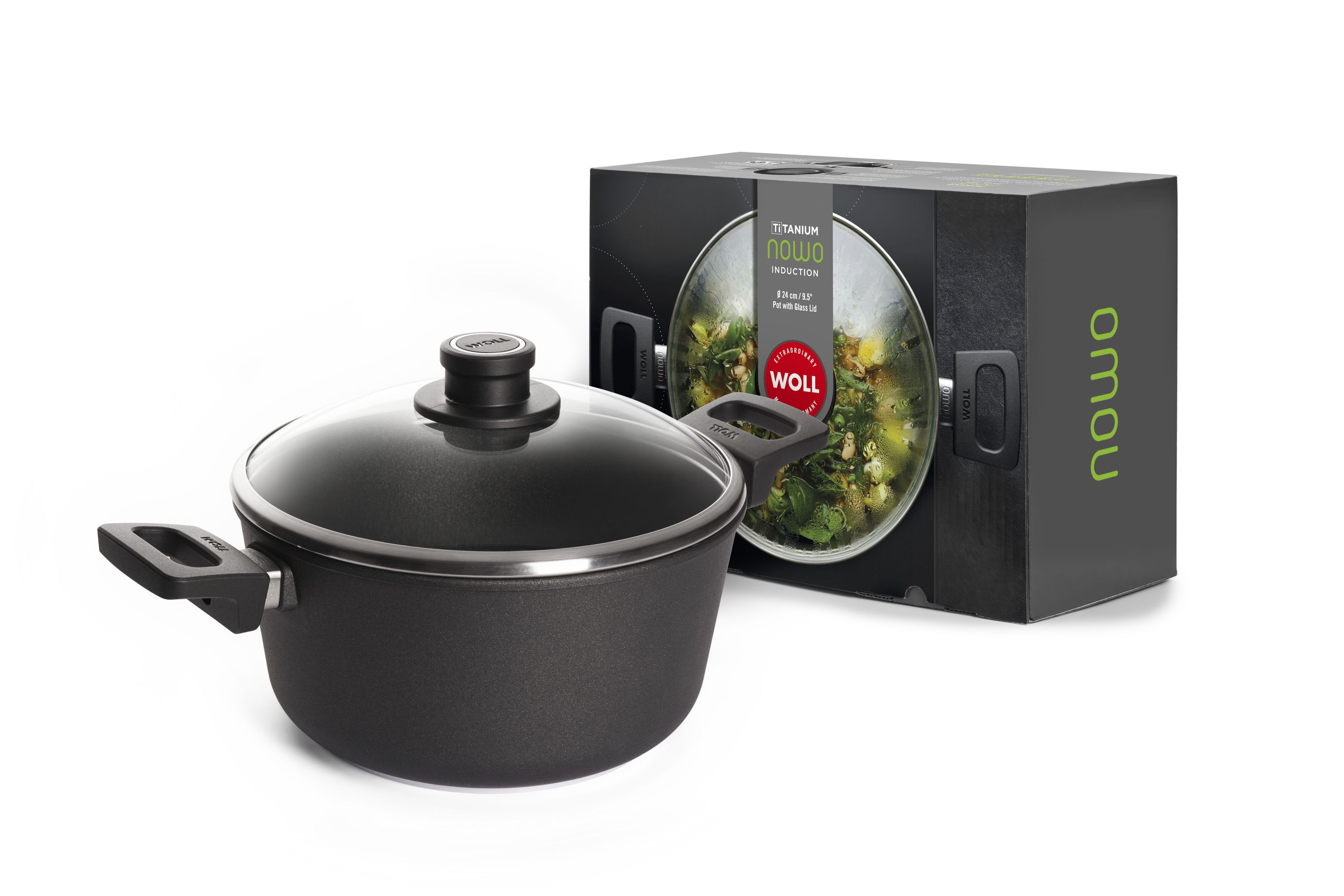 Schwarzer WOLL NOWO Induction Topf mit Glasdeckel und Verpackung mit grünem Gemüsemotiv.