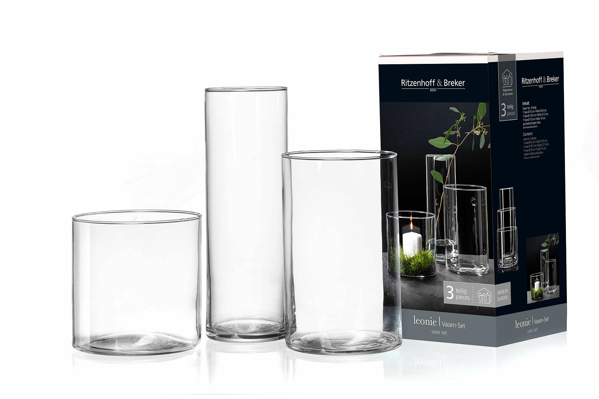 Drei zylindrische transparente Vasen unterschiedlicher Höhe aus Glas