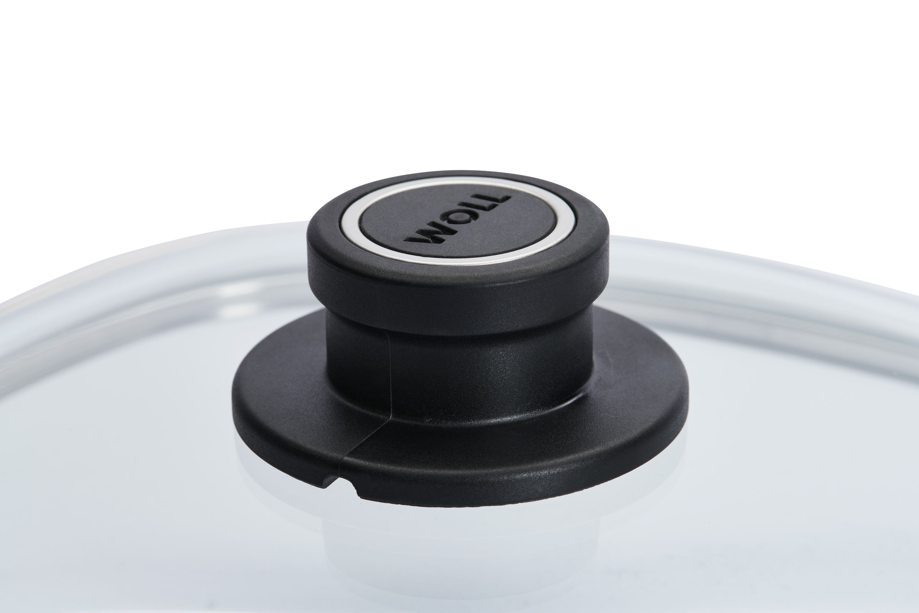 Schwarzer Deckelknauf mit silbernem Ring und WOLL-Logo auf Glasdeckel.