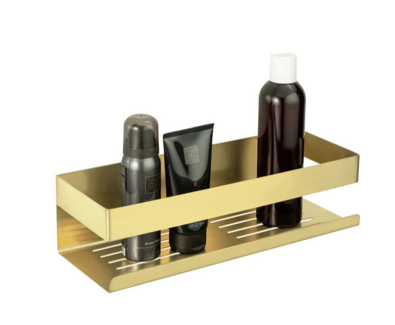 Goldfarbene Wandablage mit Sprühdose Tube und Flasche leicht erhöht und schräg aufgenommen