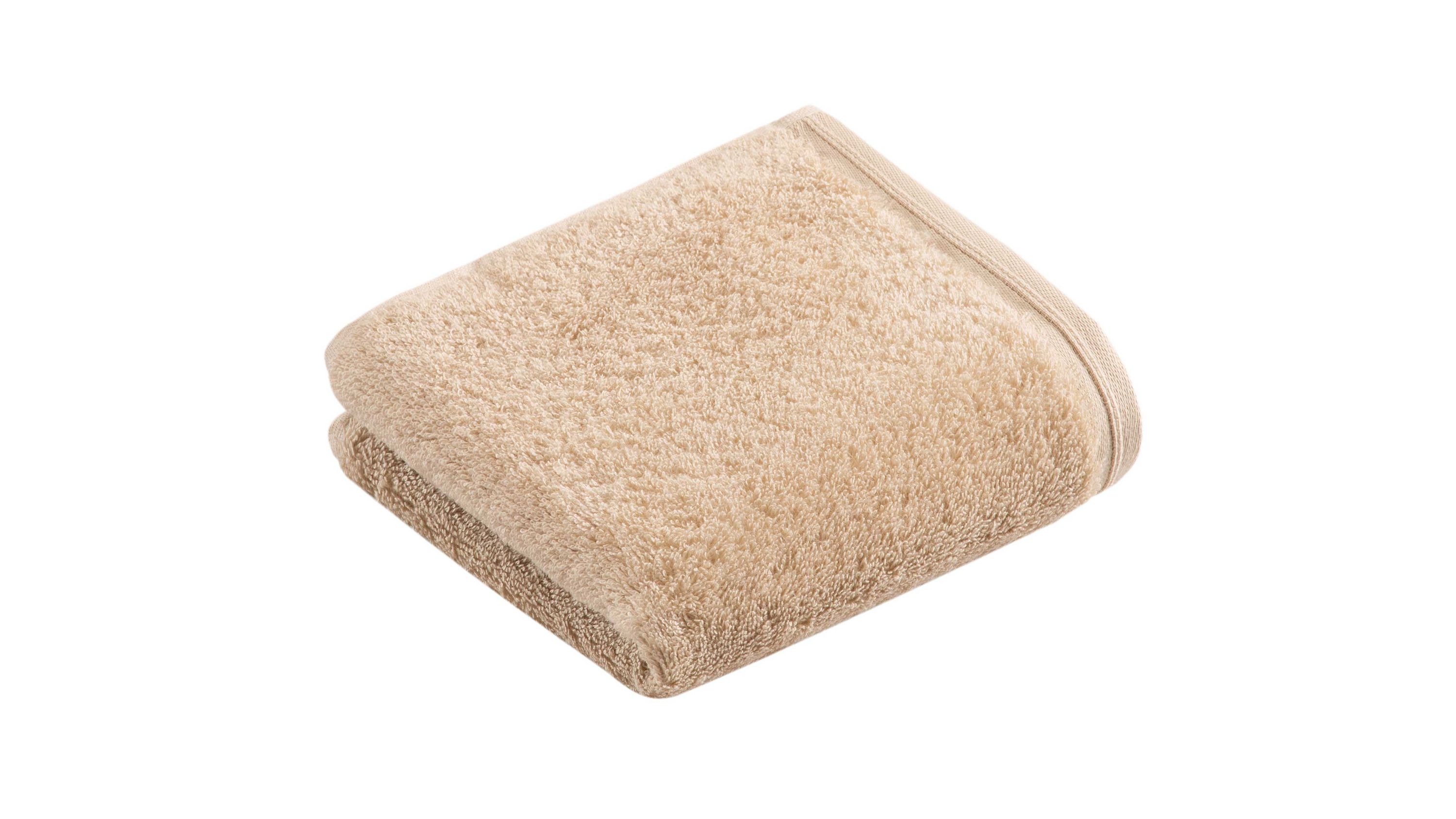 Gefaltetes Gästehandtuch in beige mit weicher Oberfläche