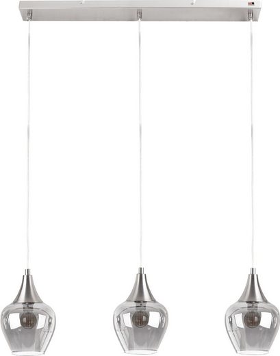 Drei Pendelleuchten mit zylindrischem Glasschirm und Aluminiumabschluss  seitlich inszeniert über Esstisch im Wohnambiente