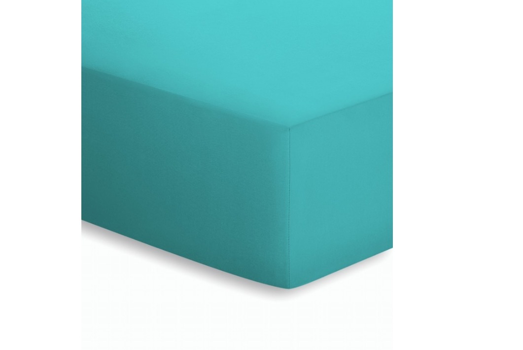 Türkisfarbenes Jersey-Elasthan-Spannbettlaken aus Baumwolle von schräg oben fotografiert eng um Matratzen-Ecke gespannt
