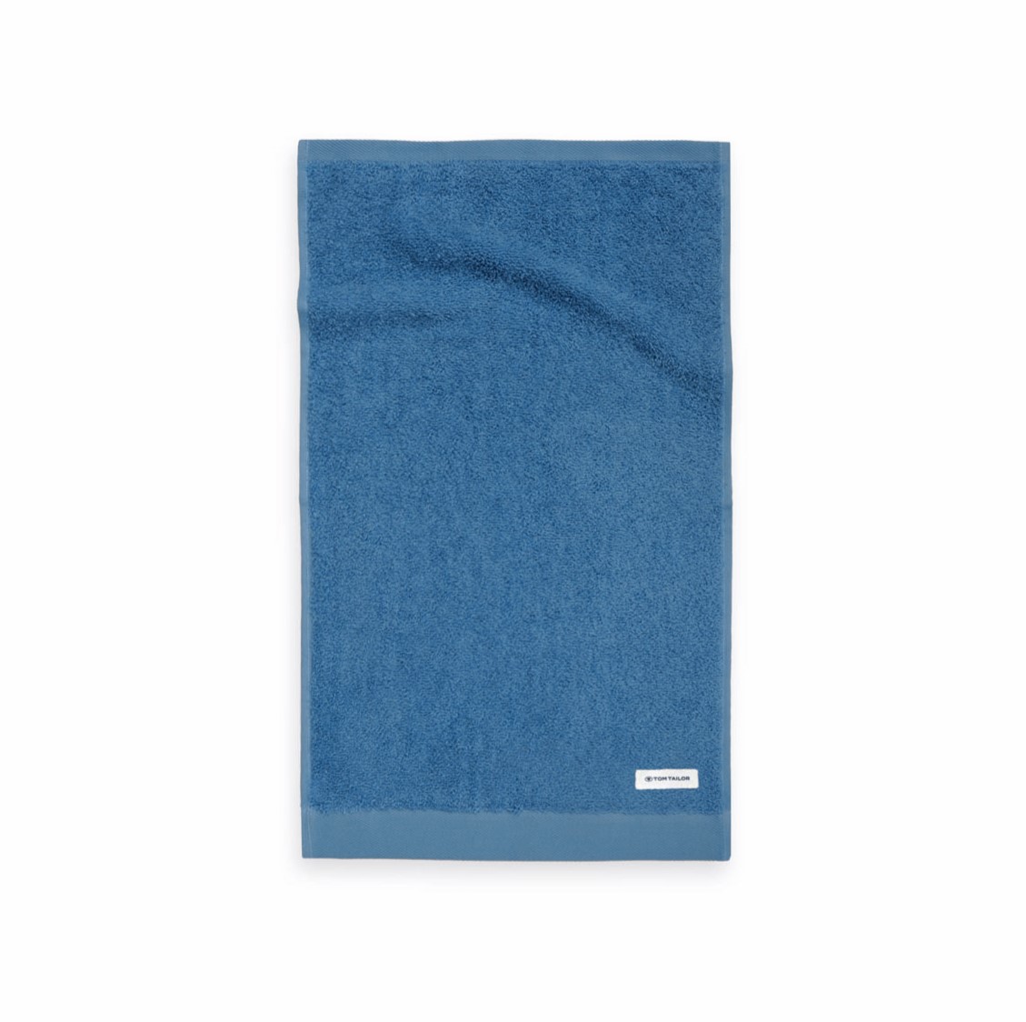 Blaues Handtuch weiches Frottier mit Markenlabel in der Ecke
