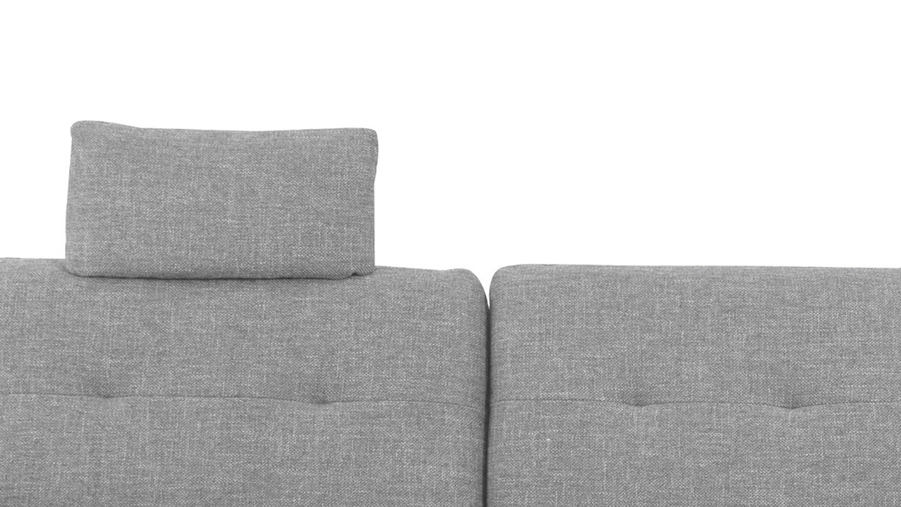 Kopfstütze mit hellgrauem Stoffbezug auf Polster Hellgraue rechteckige Kopfstütze mit Stoffbezug auf hellgrauem Polster