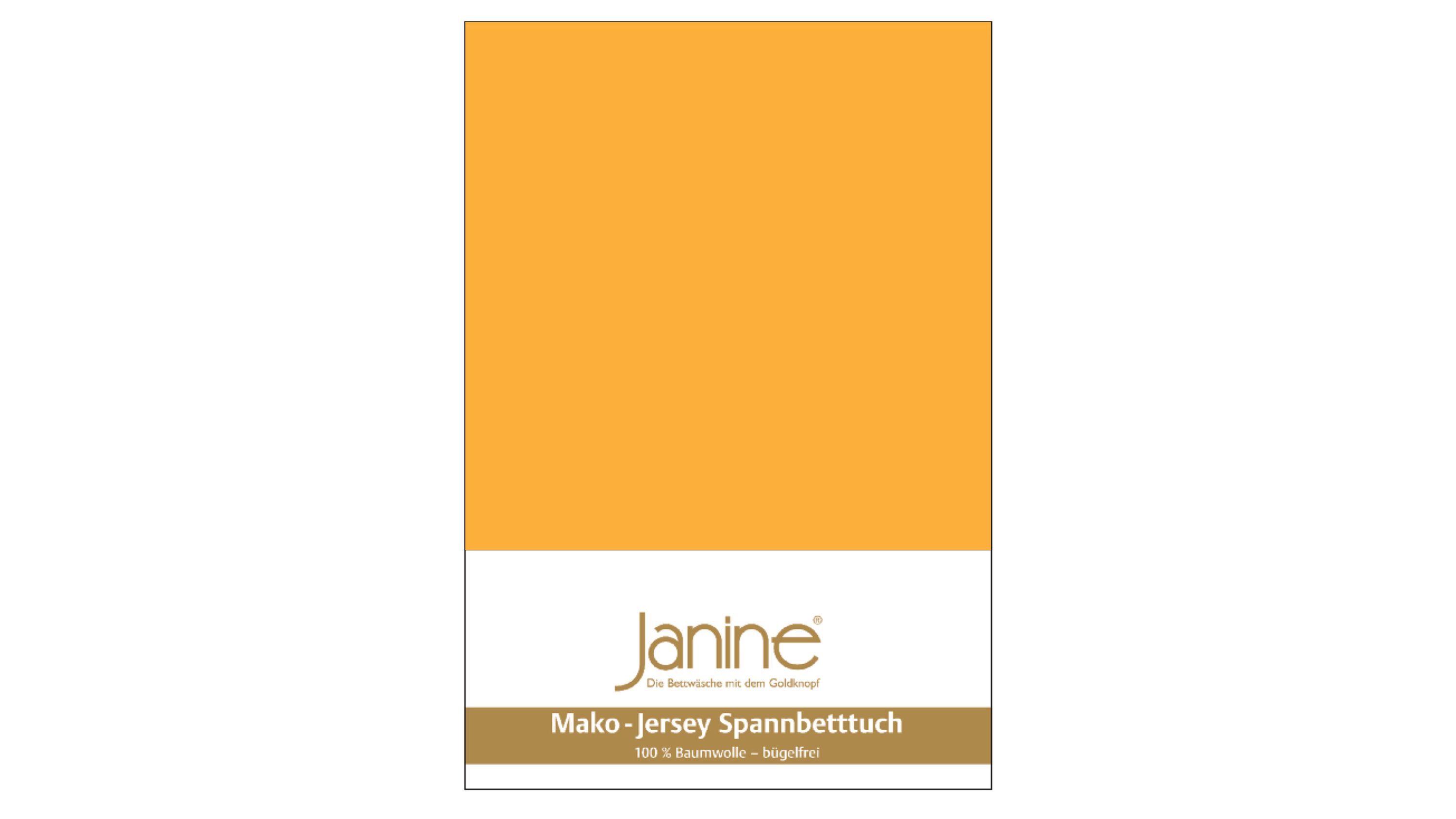 Spannbettlaken in sonnengelb mit weißem und goldfarbenem Etikett