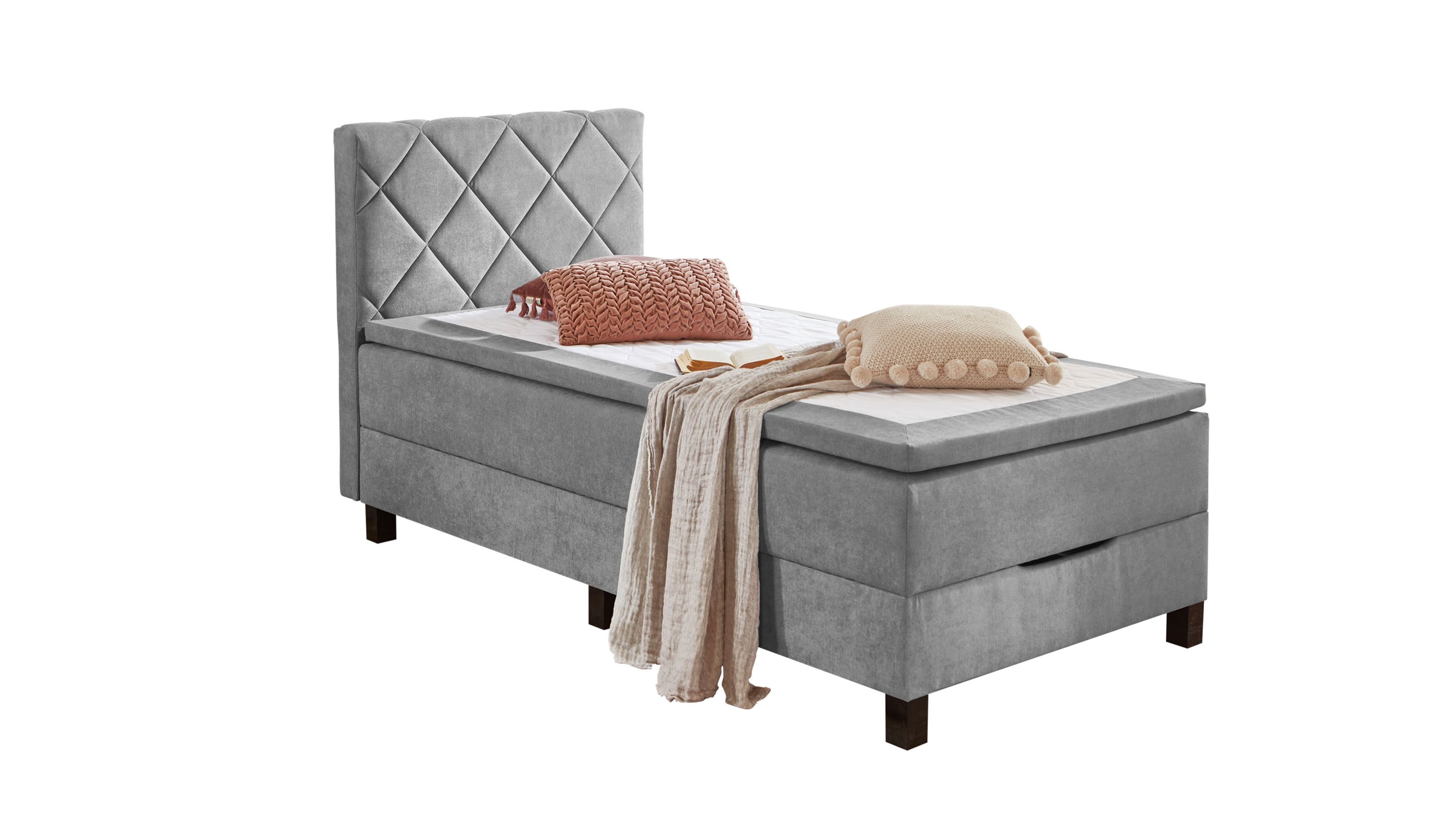 Boxspringbett mit gepolstertem Kopfteil in Silber Boxspringbett mit hohem gepolstertem Kopfteil in silberfarbenem Bezug und dunklen Beinen