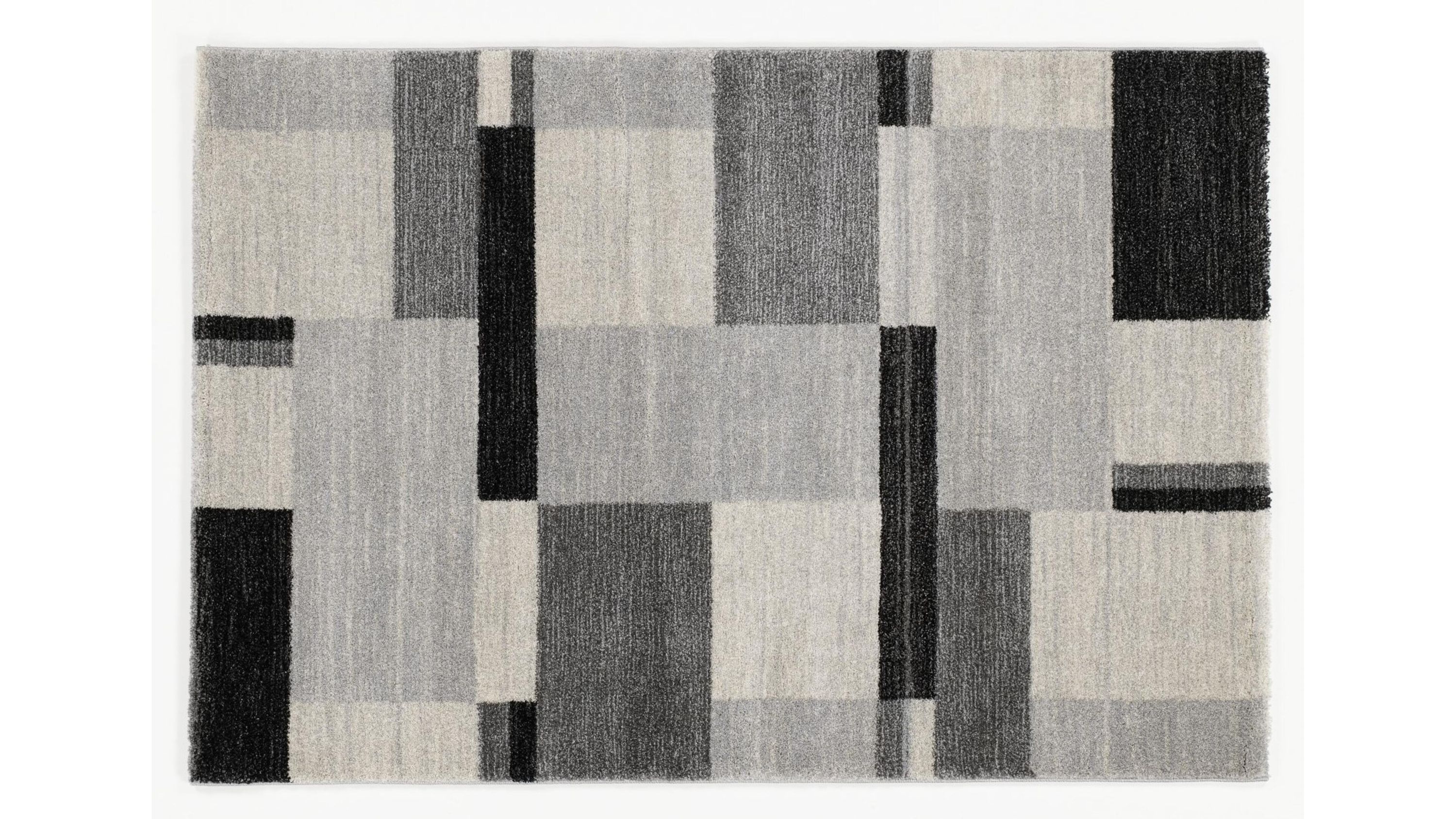Rechteckiger Teppich mit geometrischem Muster aus grauen und schwarzen Rechtecken
