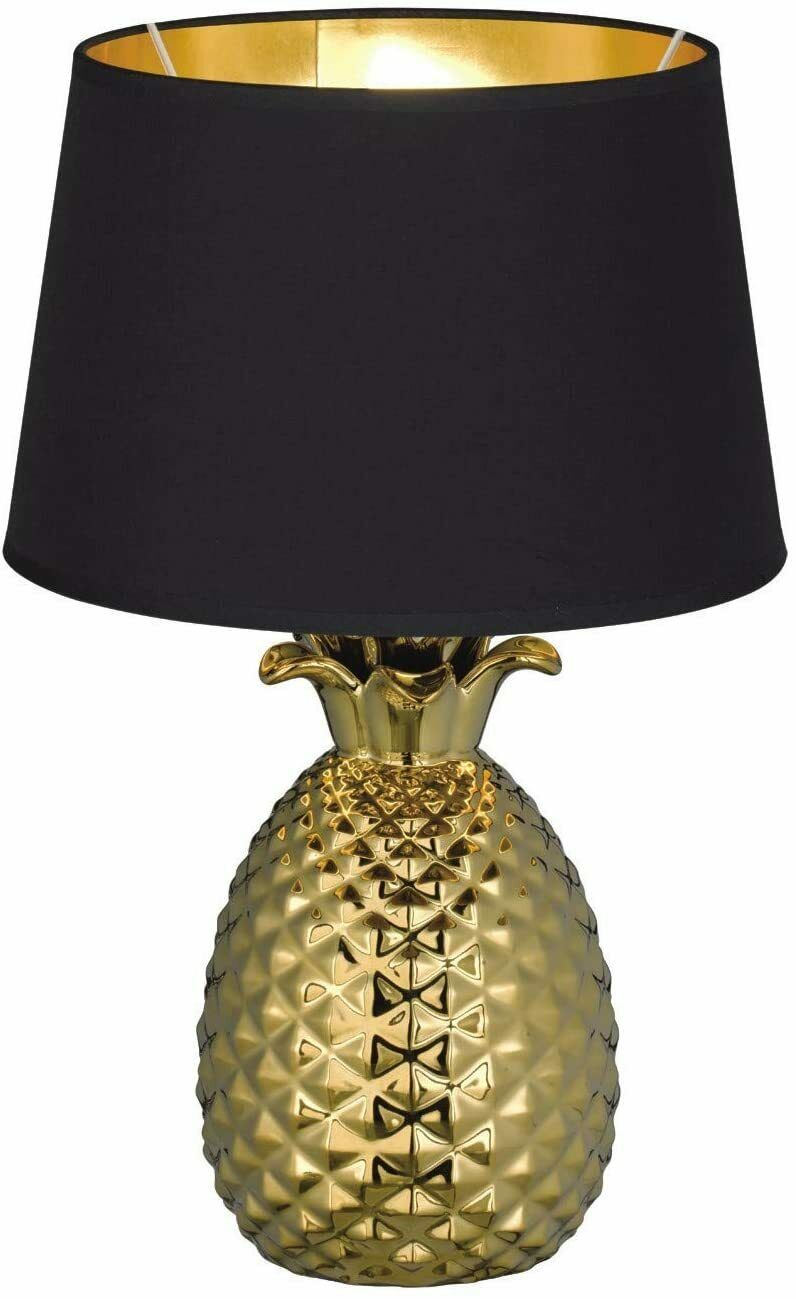 Ananas-Tischlampe mit schwarzem Schirm Goldene Lampe in Ananasform mit schwarzem Lampenschirm, frontal fotografiert, auf weißem Hintergrund