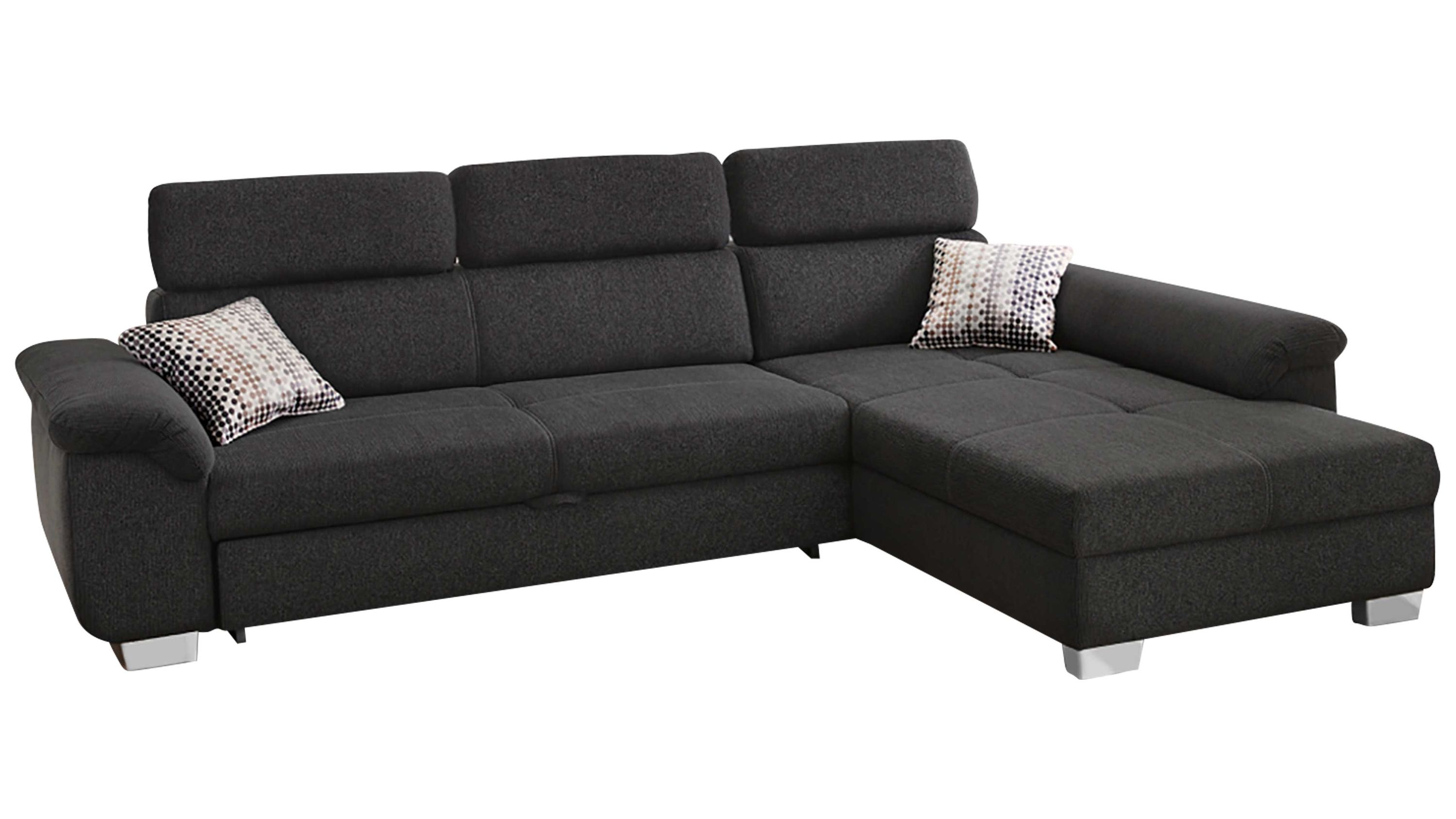 Anthrazitfarbenes Ecksofa mit drei Rückenlehnen und zwei gemusterten Kissen