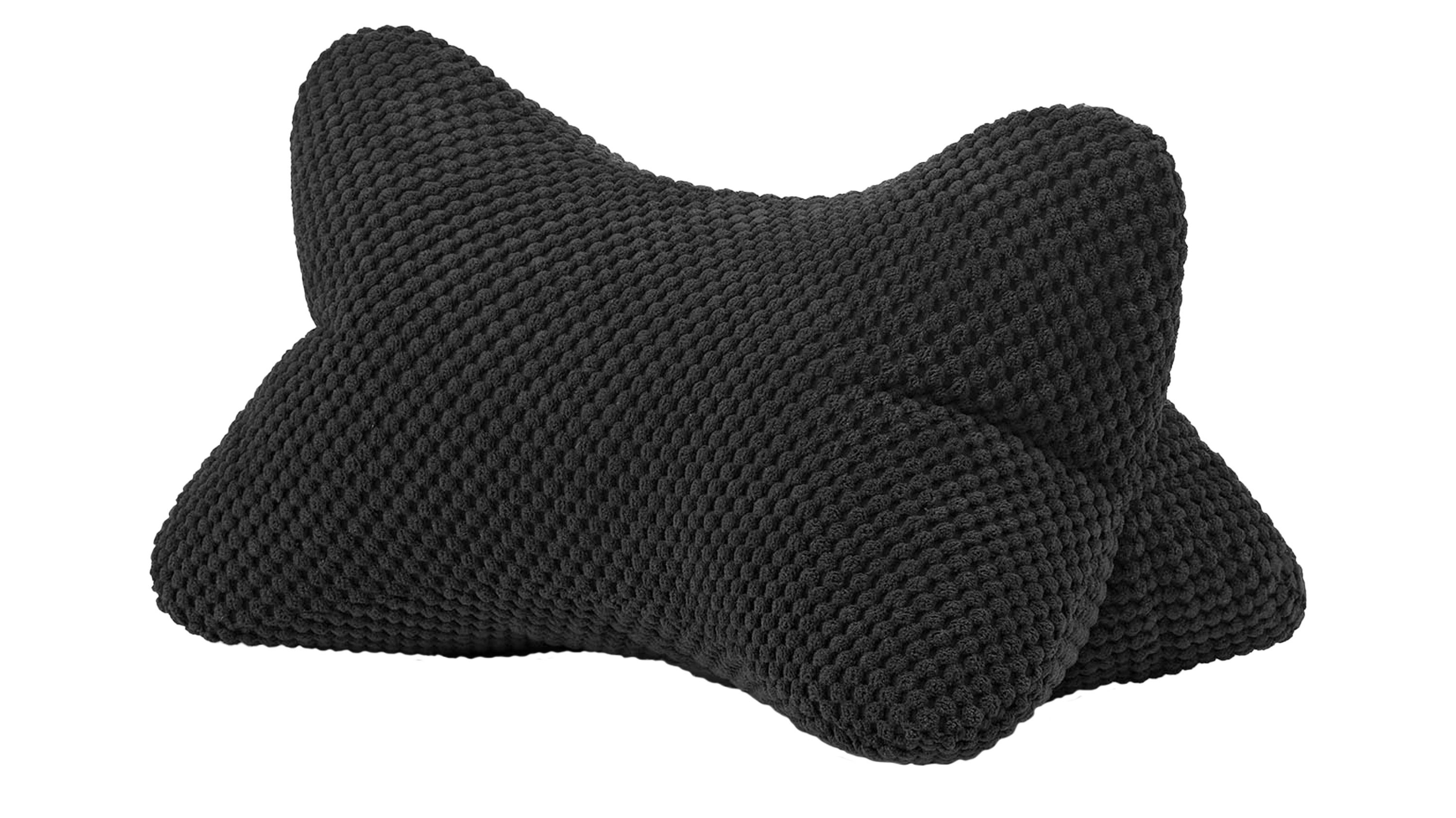 Schwarzes Lesekissen in Knochenform mit strukturierter Oberfläche