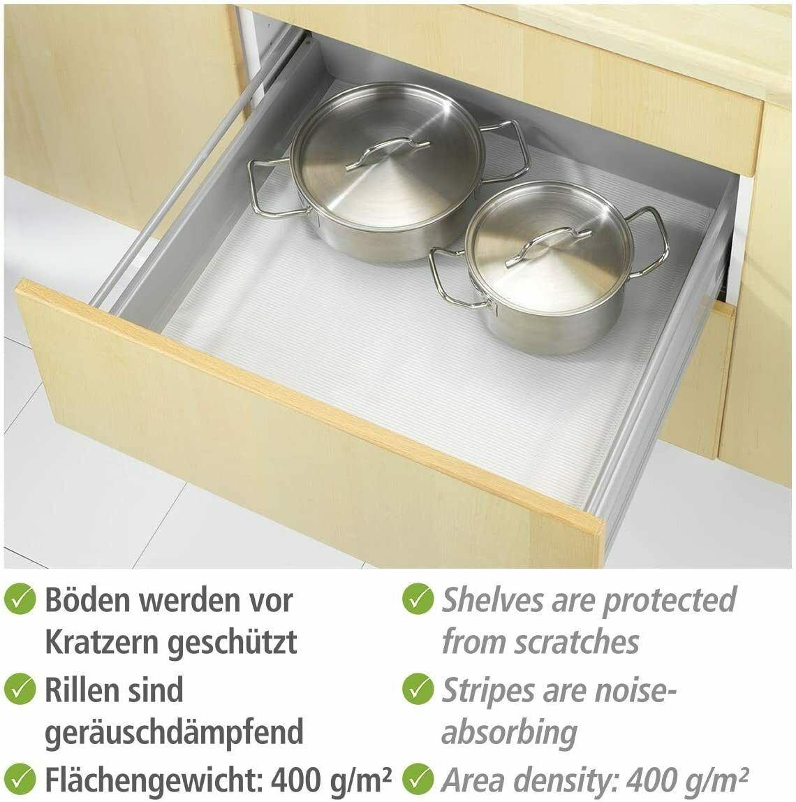 Transparente Anti-Rutsch-Matte in offener Schublade  zwei Metallschalen darauf platziert  schützt vor Kratzern und Lärm