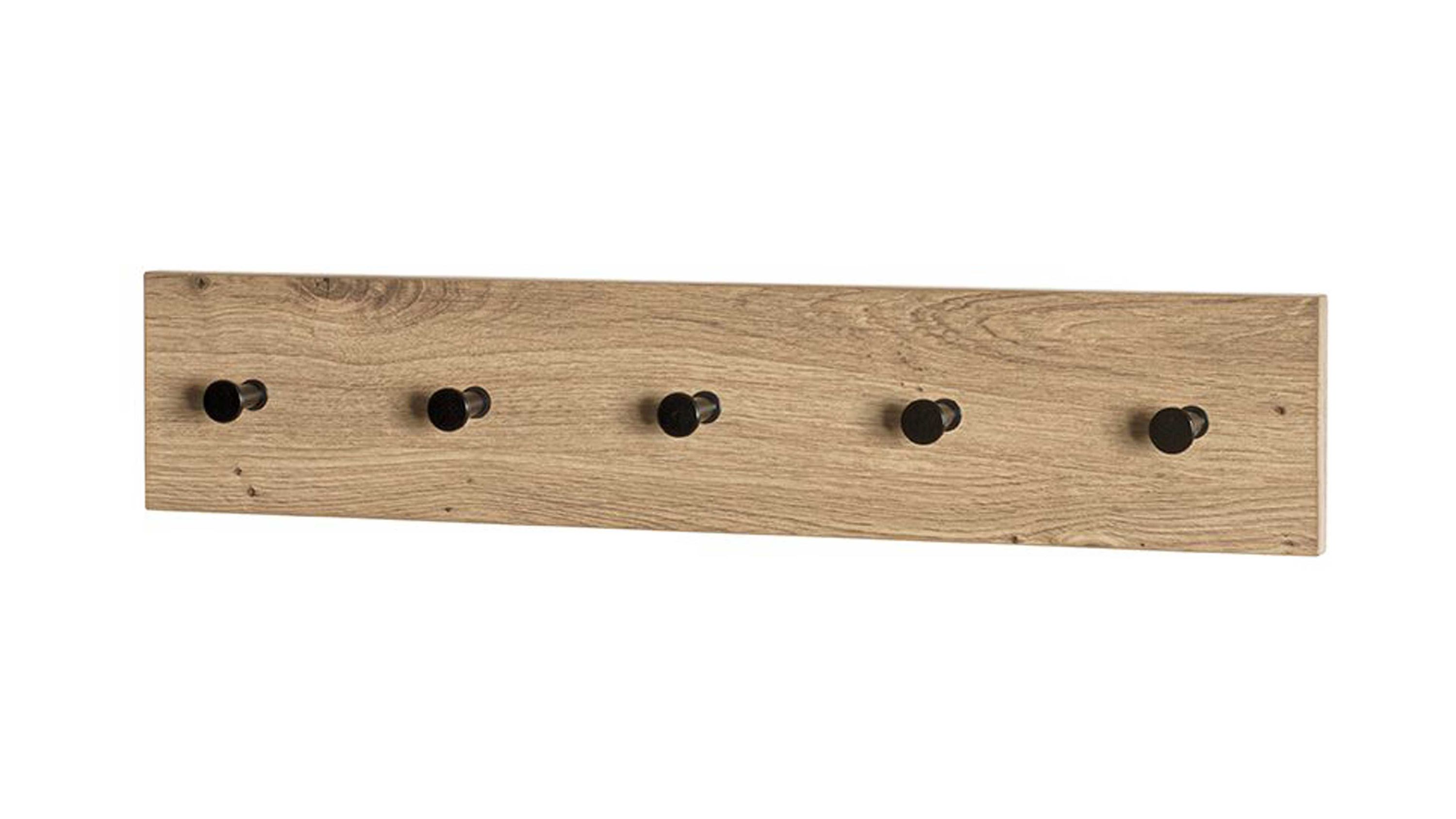 Rechteckige Wandgarderobe mit fünf schwarzen runden Haken auf hellbraunem Holz