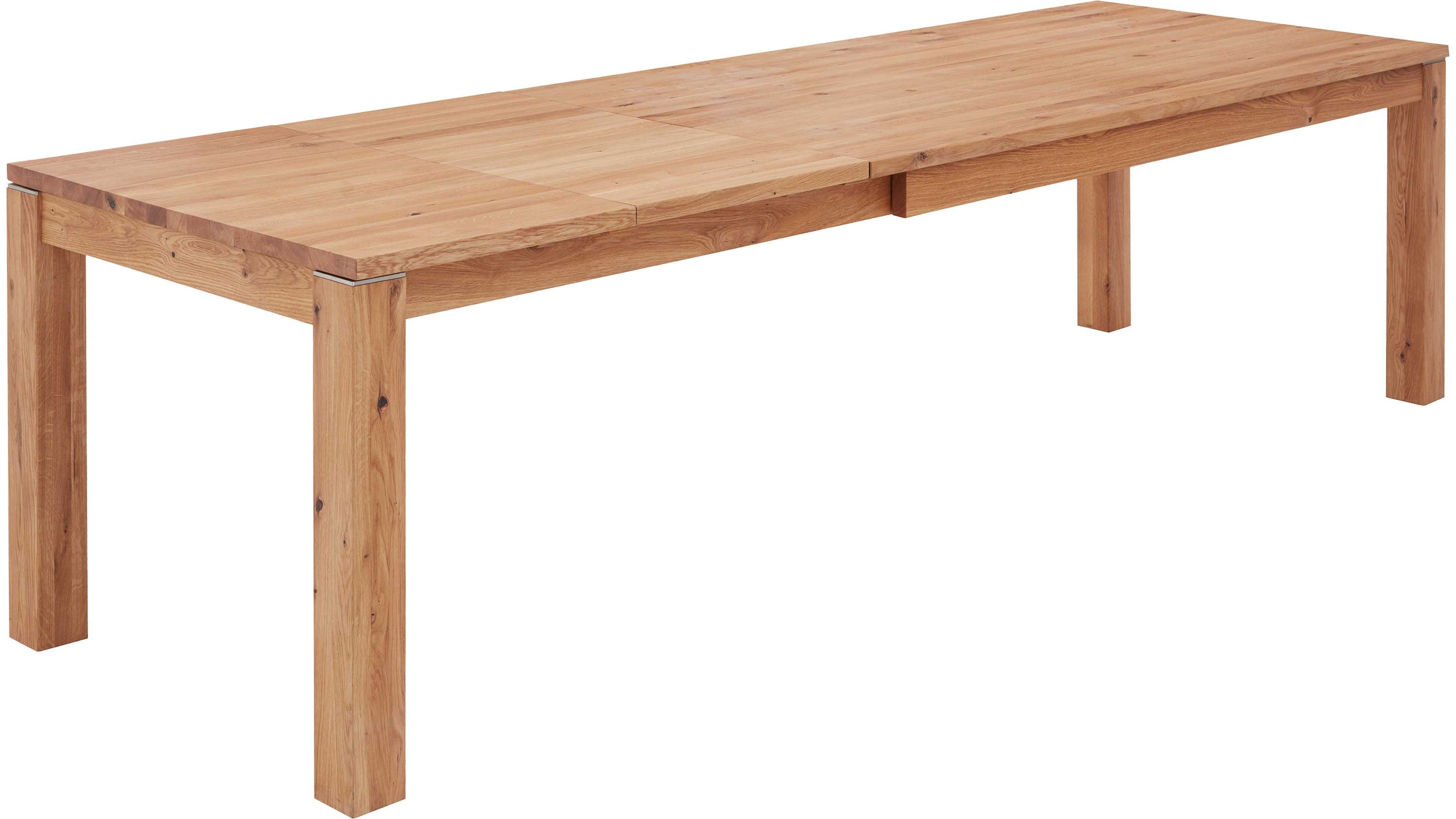 Auszugtisch aus hellem Holz mit rechteckiger Tischplatte und vier quadratischen Beinen