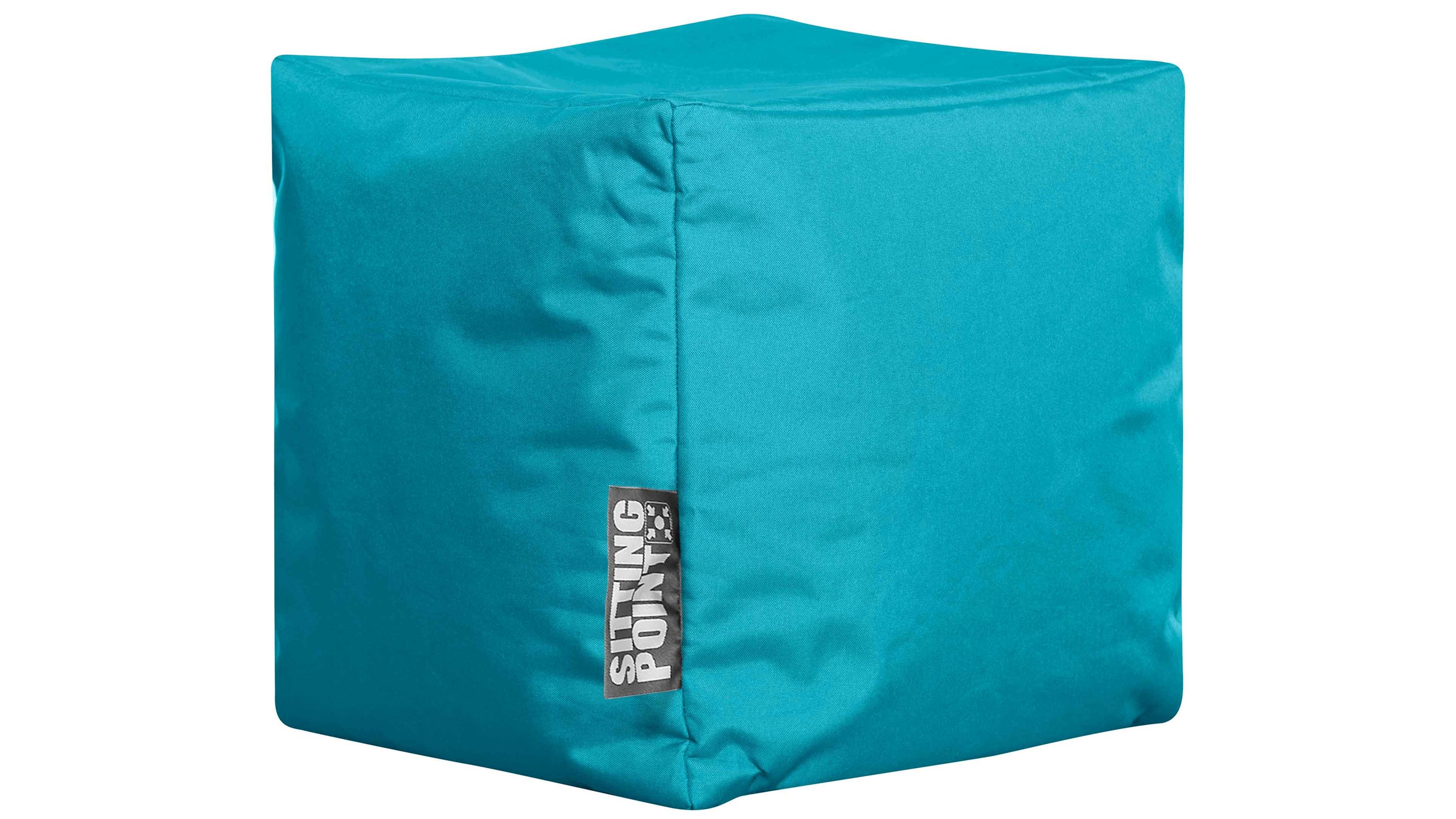 Quadratischer Sitzwürfel in petrolblauer Farbe mit sichtbarem Markenetikett
