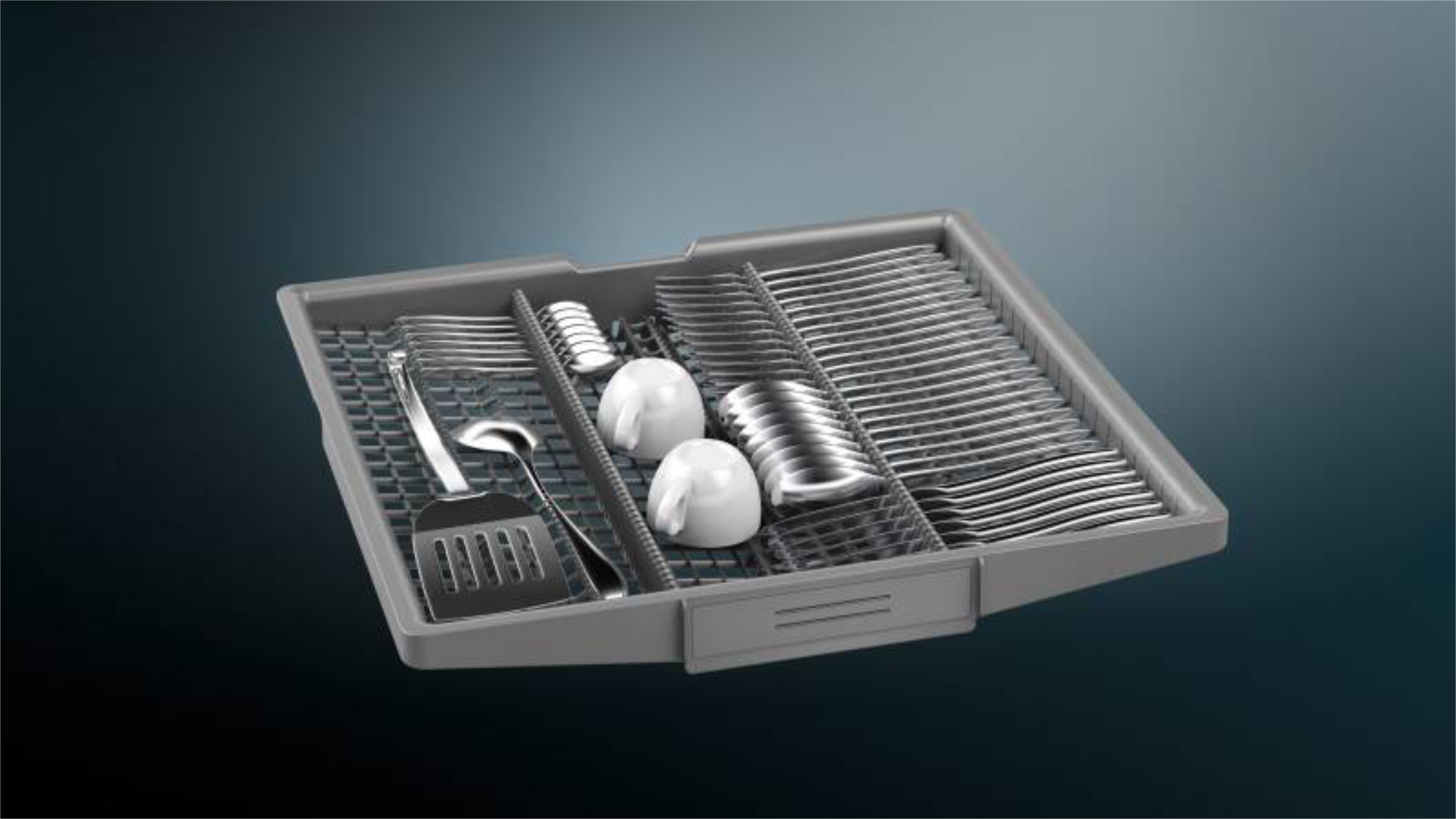Innenansicht Siemens XXL-Geschirrspüler SX63HX61CE  60?cm  Fokus auf obere Besteckschublade mit weißen Kugeln