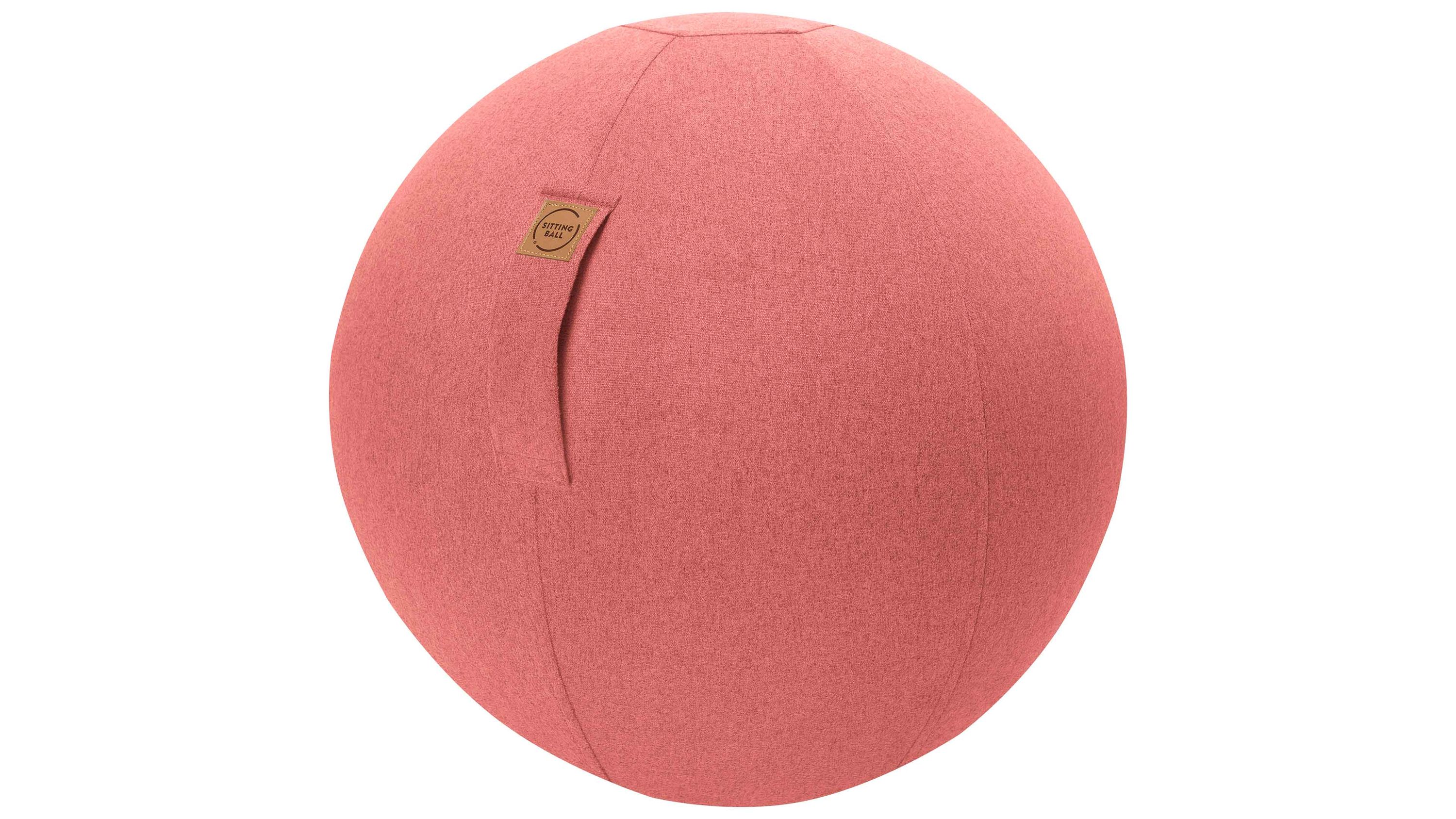 Runder Sitzball mit lachsfarbenem Bezug und Grifflasche