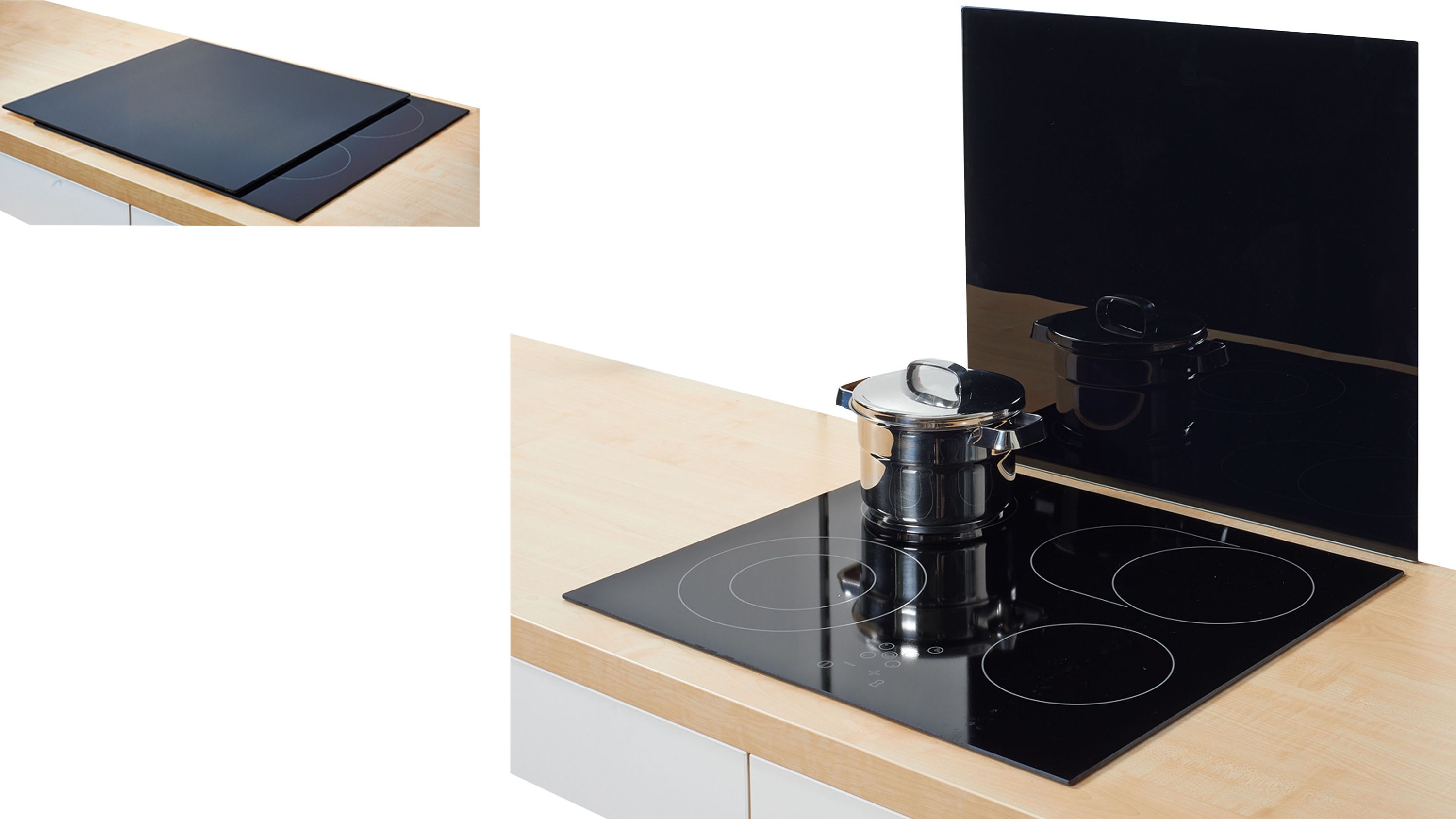 Schwarze Herdabdeckplatte und Rückwandschutz aus Glas auf einer Küchenarbeitsplatte mit einem Topf