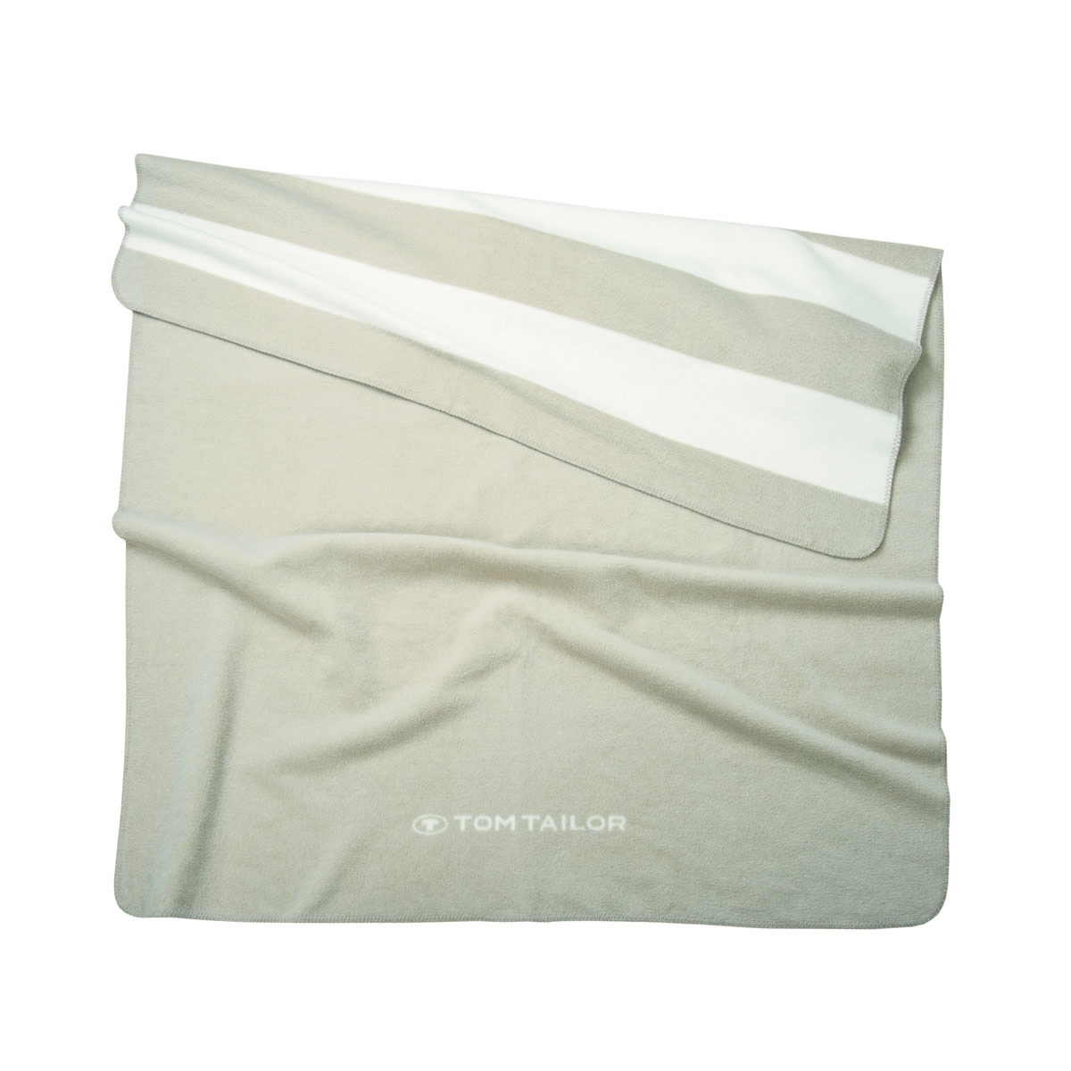 Draufsicht auf gefaltete Jacquard-Kuscheldecke mit Streifenmuster in Beige und Weiß