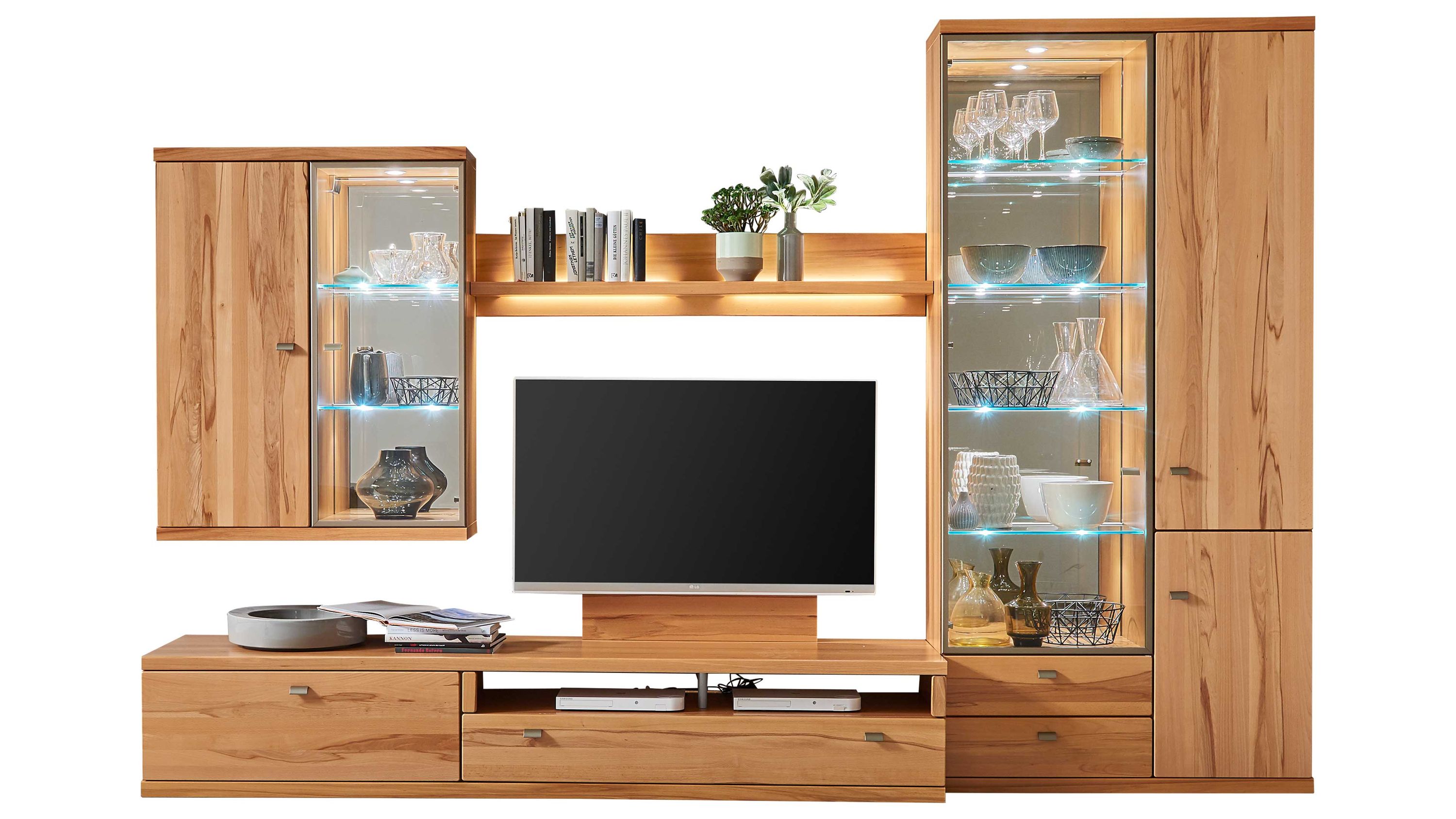 Wohnwand mit Holzoptik und Glastüren Wohnwand mit mehreren Schränken und Regalen in Holzoptik mit Glastüren und Beleuchtung