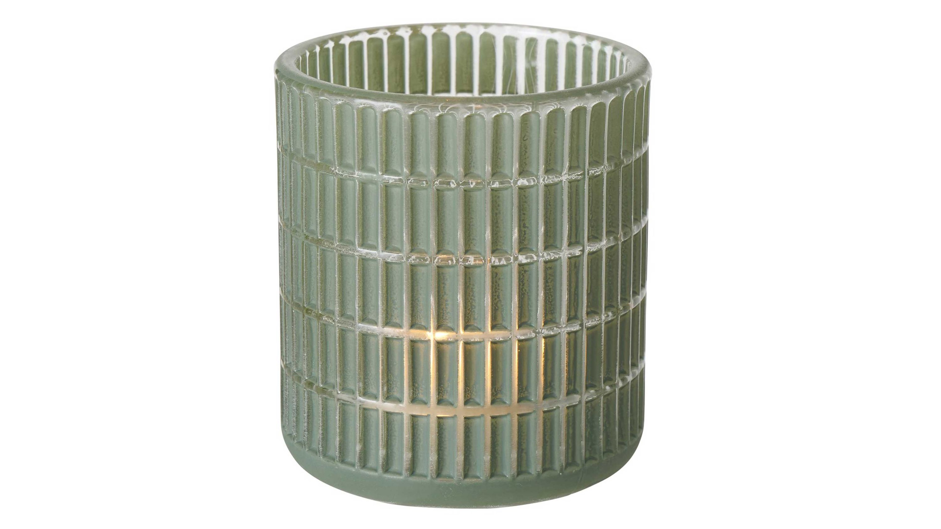Grünes rundes Teelichtglas mit Karo-Muster Rundes Teelichtglas mit kariertem Muster in grün mit brennendem Teelicht innen