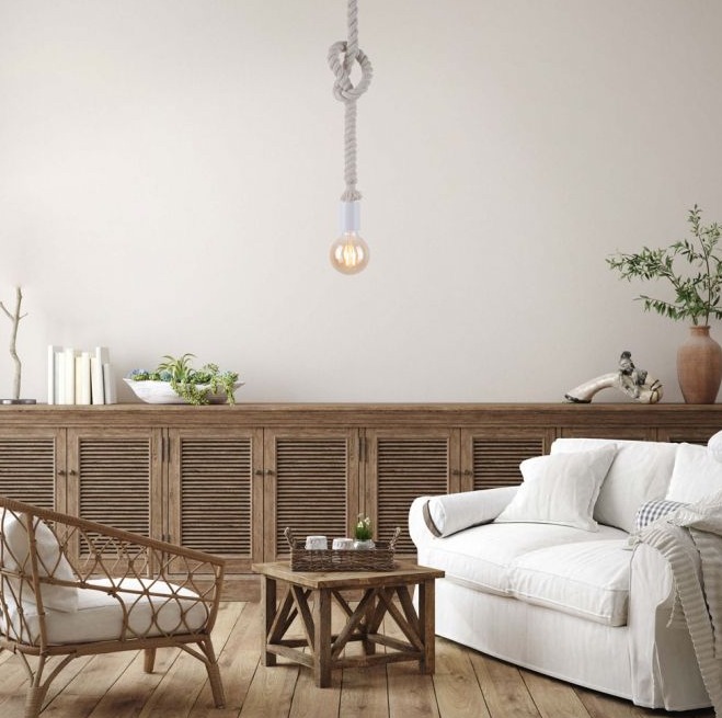 Weiße Pendelleuchte Weiße Pendelleuchte aus Kunststoff über Couchtisch in modernem Wohnzimmer im Hintergrund Sofa Sideboard Deko