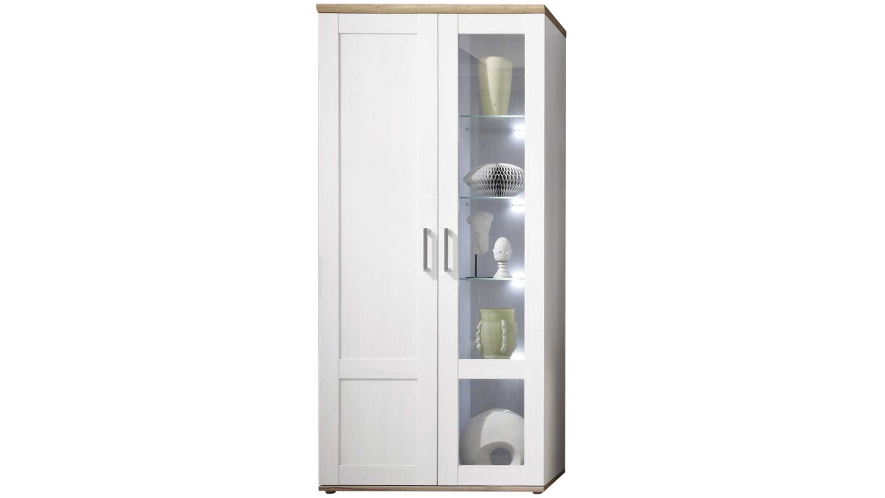 Vitrinenschrank mit zwei Türen und Glaseinsatz Vitrinenschrank mit zwei Türen eine Tür mit Glas und Regalen mit Dekoration weiße Fronten hellbraune Abdeckplatte