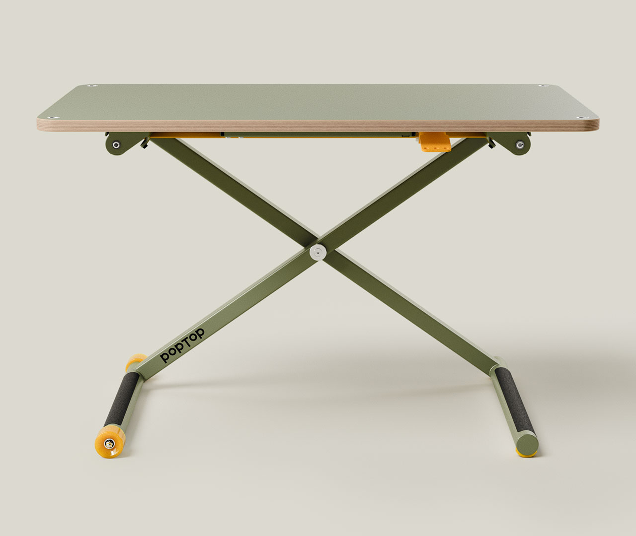 Grüner höhenverstellbarer Schreibtisch mit X-Gestell und gelben Drehknöpfen in Frontansicht.