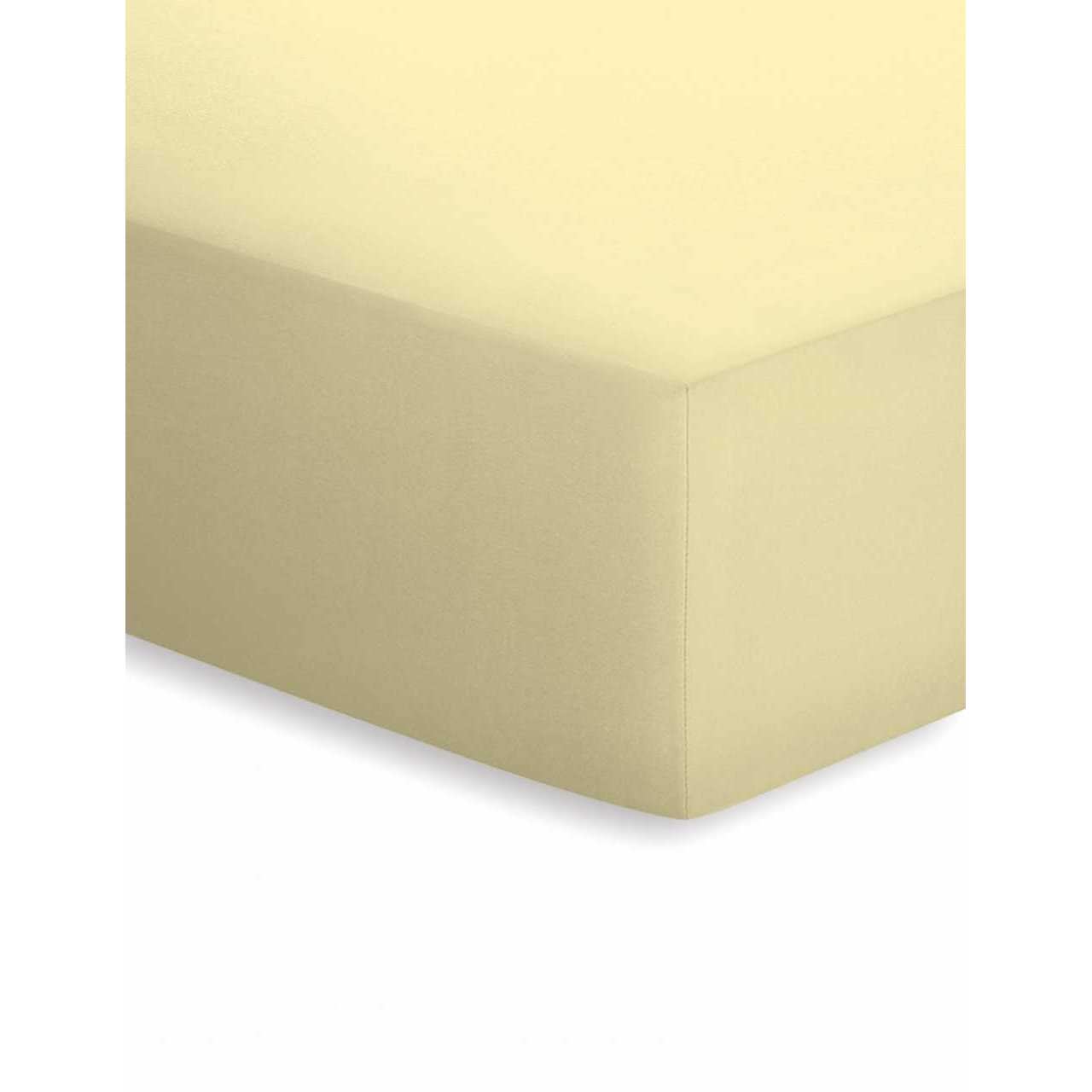 Ecke eines gelben Spannbetttuchs in Farbe Kamille