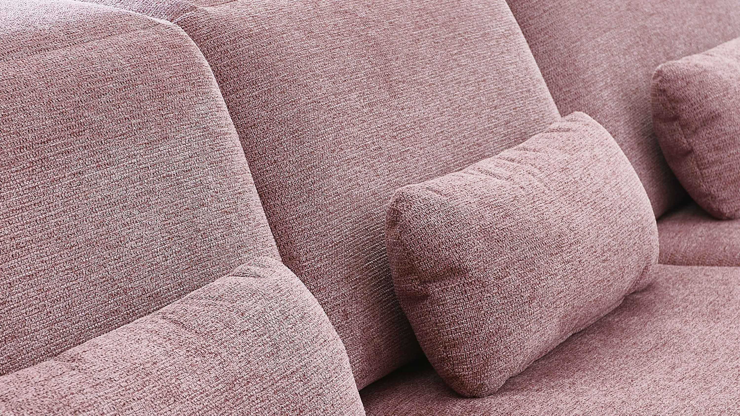 Rechteckiges Nierenkissen in rosa Webstoff auf rosa Sofa