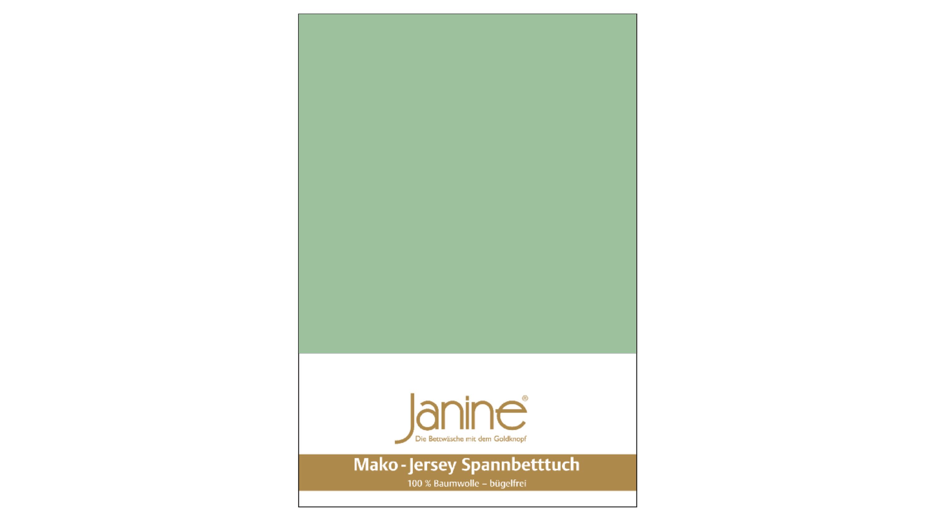 Grünes Spannbettlaken aus Jersey-Stoff mit Verpackung und Markenaufdruck