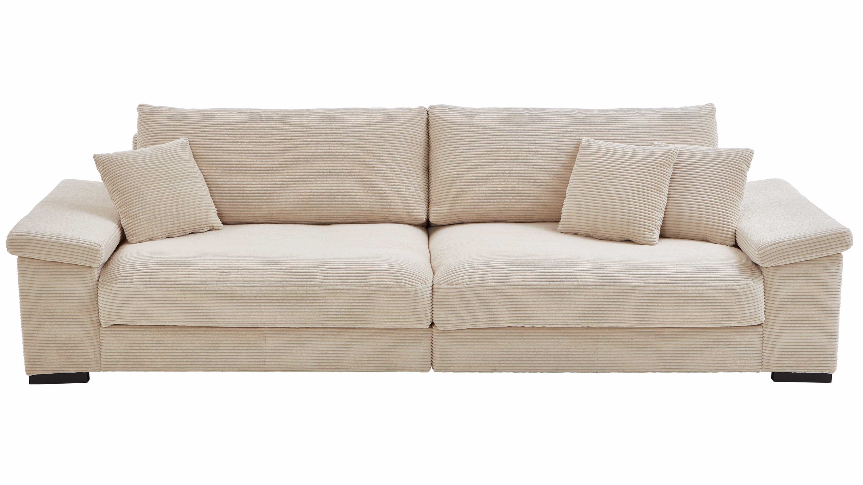 Cremefarbenes Bigsofa aus Breitcord mit Kissen Breitcordsofa in creme mit zwei Sitzflächen und vier Kissen
