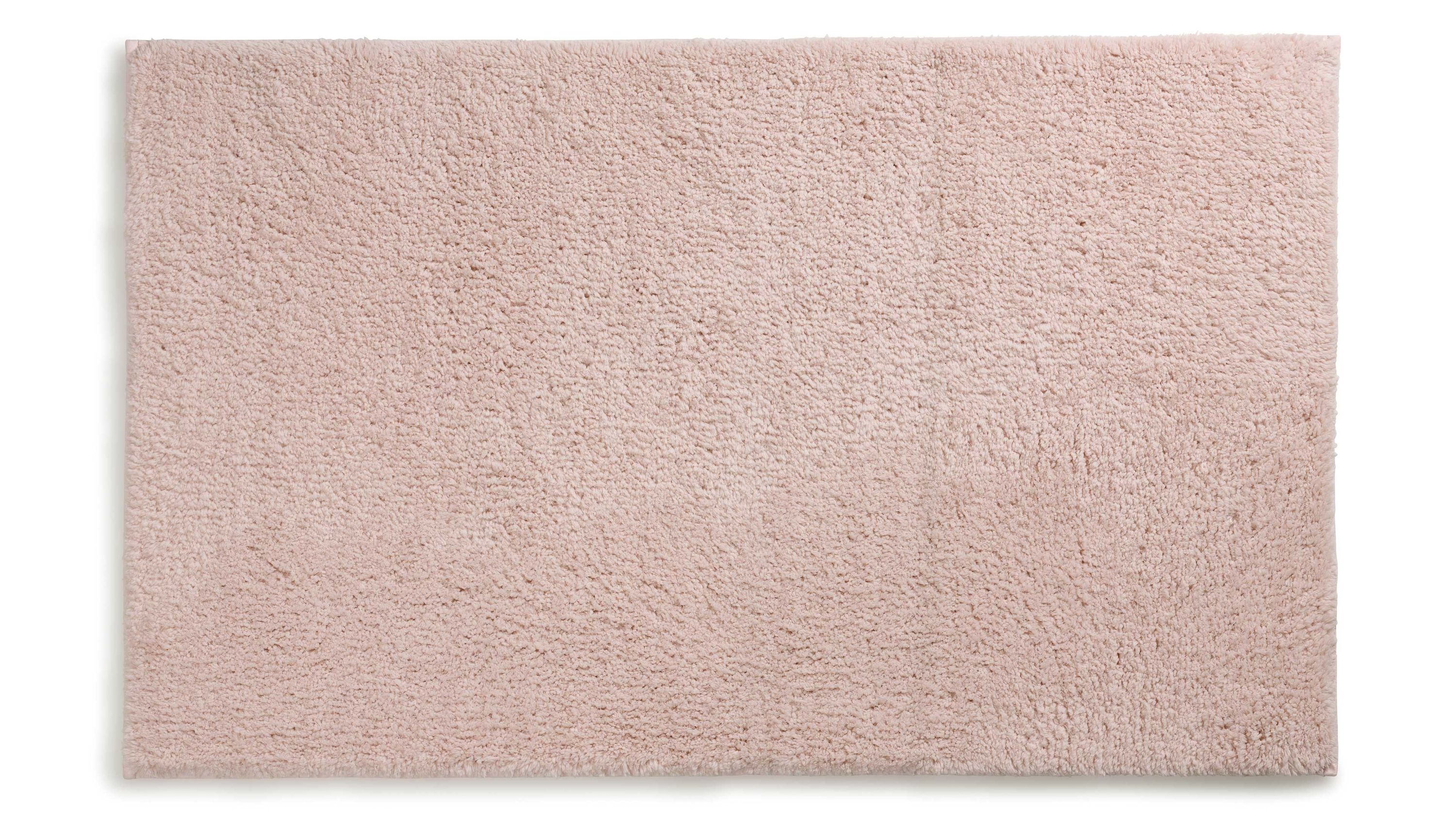 Rechteckige rosa Badematte mit flauschiger Oberfläche Rechteckige Badematte in einfarbigem rosa mit weicher flauschiger Oberfläche
