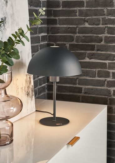 Seitlich fotografierte Tischleuchte aus matt anthrazitfarbenem Aluminium mit glattem Schirm und zylindrischem Fuß