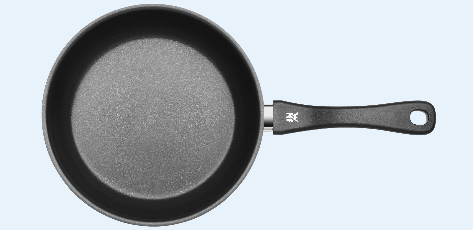 Draufsicht auf runde Edelstahl-Bratpfanne mit schwarzer Antihaftbeschichtung und ergonomischem Griff